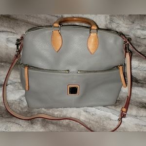 Dooney & Bourke gray purse with handles and shoulder strap.